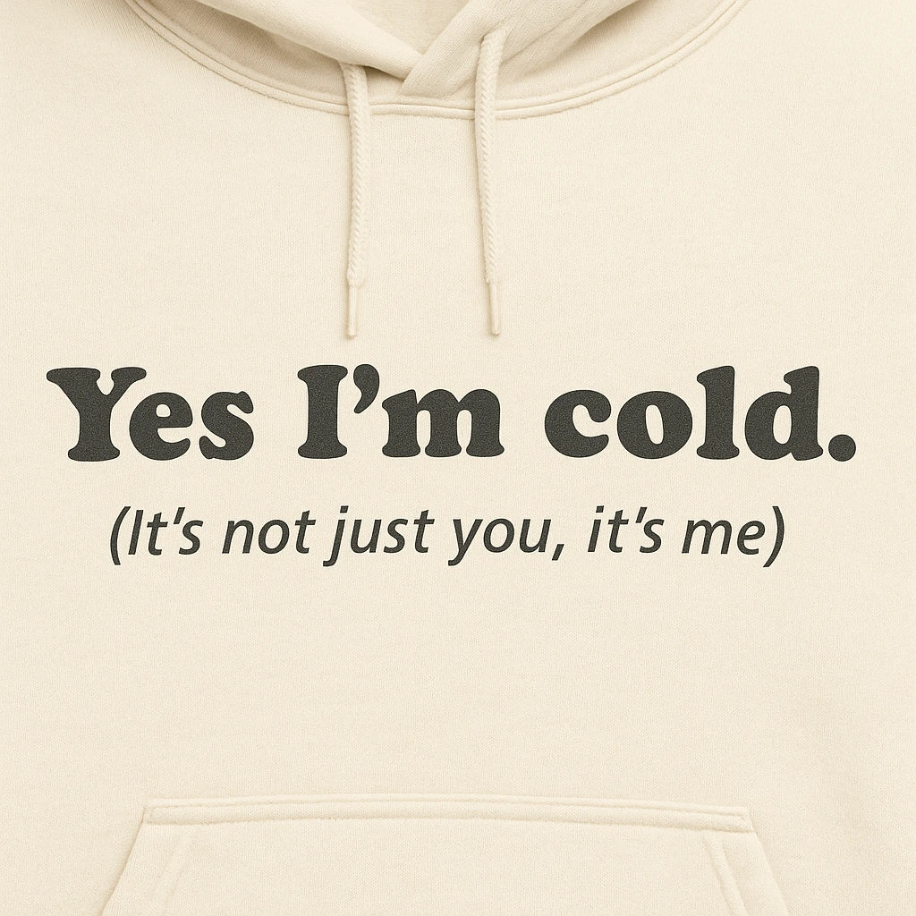 Cream hoodie with text 'Yes I'm cold. (It's not just you, it's me)' on a beige background