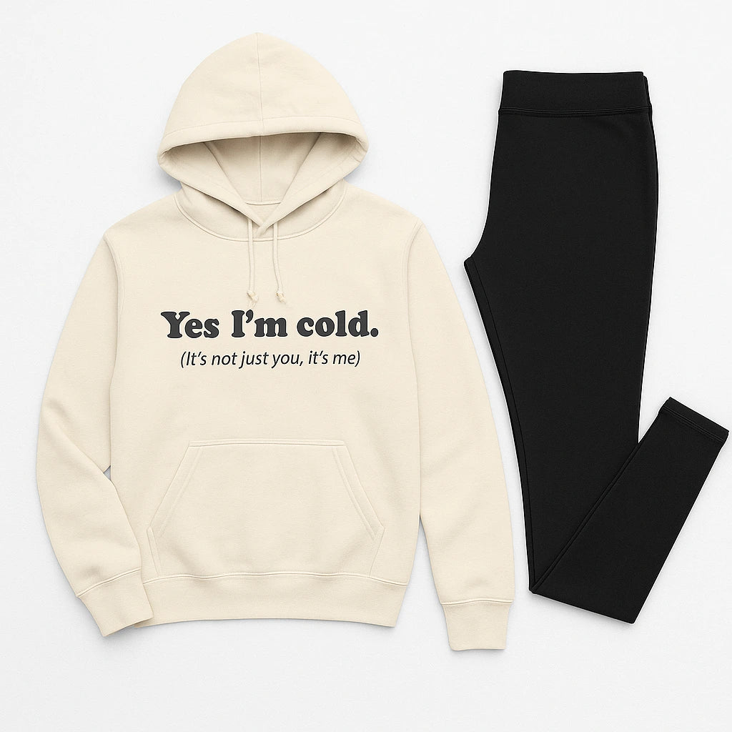 Cream hoodie with text and black leggings on a white background