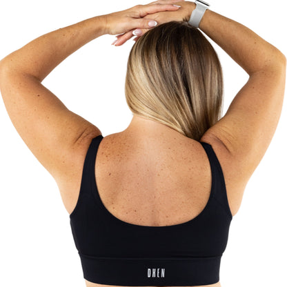 Black Sports Bra with a Thick Waist Band providing Push Up and Support